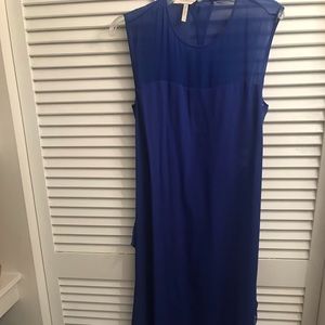 Long blue dress with open back.